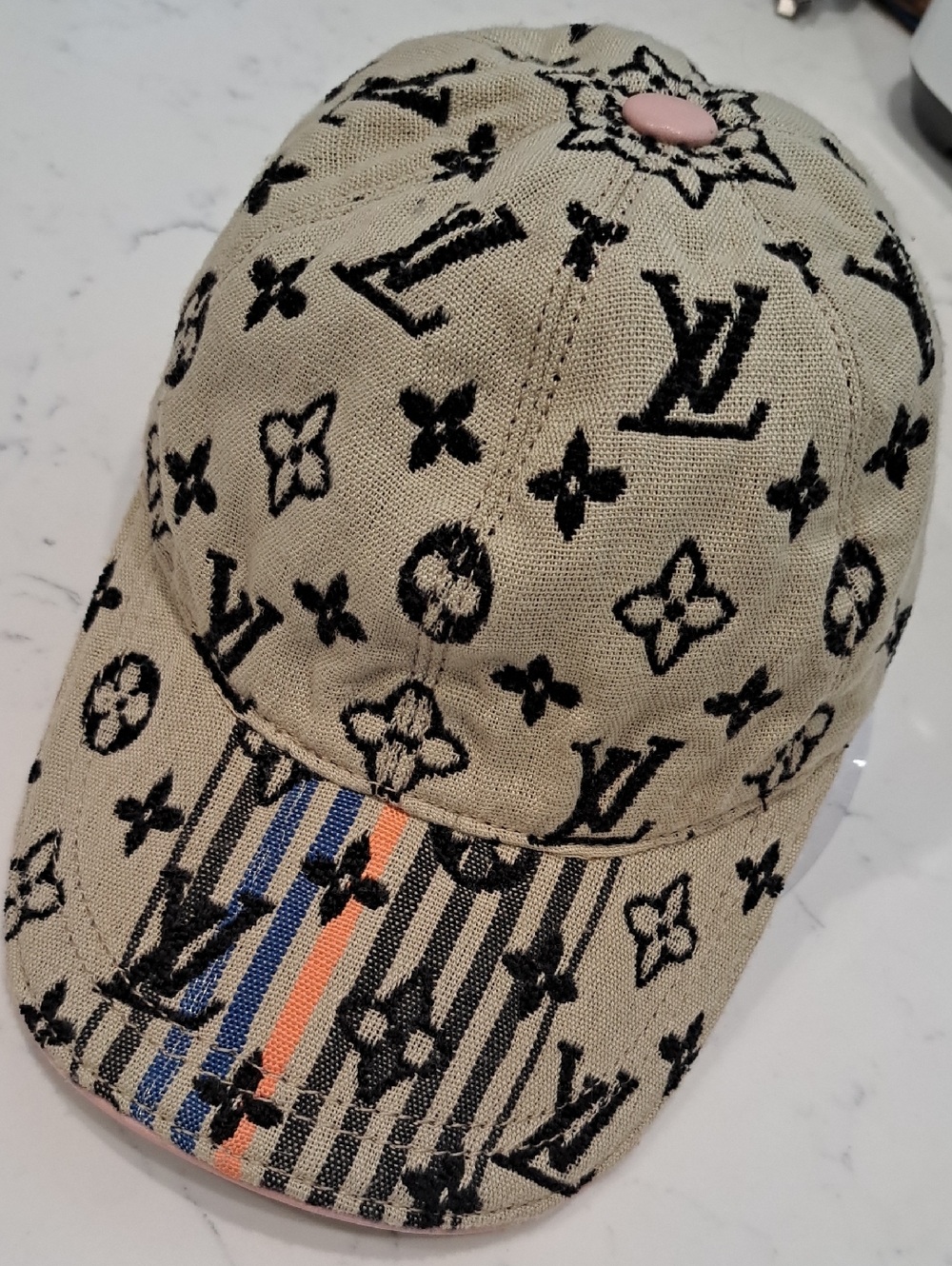 Louis Vuitton Beige Monogram Cap with Black Print and Pink Button